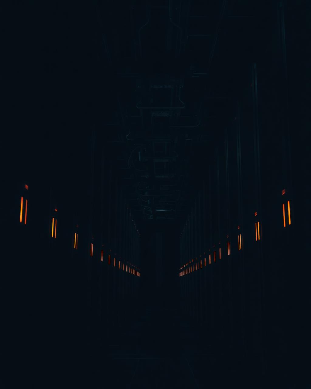 Dark data center hall with orange indicator lights